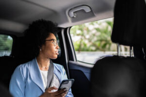 Woman using white label eSim in Taxi