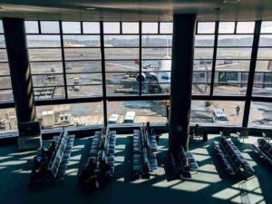 Image of an airport lobby and a few travelers