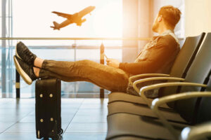A traveler starring at a departing plane