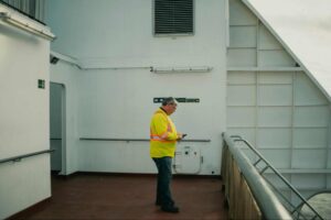 crew officer handling phone on a ship