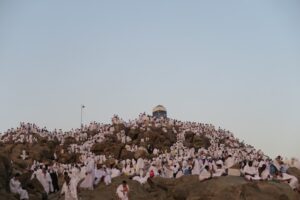 large group of people on a rocky hill